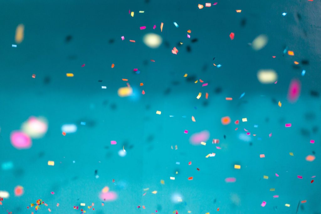 Confetti falling with blue background