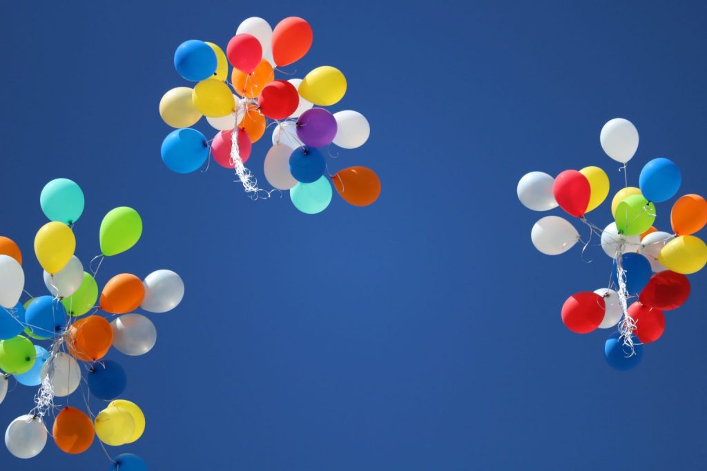 balloons in air floating upwards