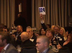 Not every raised paddle in the room came from a table sponsor. Underwriting opportunities staggered down to a few hundred dollars meant newer corporate partners and out-of-town supporters could still show up with visibility, building a pipeline Chelsea expects to convert into full table commitments in the years ahead.