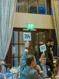 To the donors in the room, a paddle raise is the emotional high of the evening. To the team behind it, every hand in the air used to mean another row of manual data entry and weeks of reconciliation ahead. "When we did our paddle call last year," said Lauren Williams, "that took weeks to organize and get all that in."