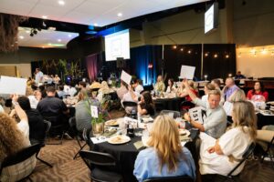 Guests raise their bid paddles during St. Bernard’s Healthcare’s Fund the Mission appeal, which brought in $65,000 in ten minutes.
